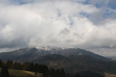 Sweeping views over the tree lined and occasionally snowy valleys and hills of the Black forest around Badenweiler in southern Germany near the border with Switzerland at the heart of Europe