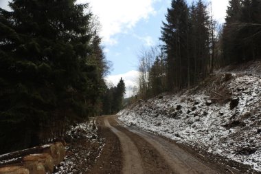 Sweeping views over the tree lined and occasionally snowy valleys and hills of the Black forest around Badenweiler in southern Germany near the border with Switzerland at the heart of Europe