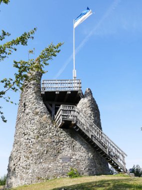 Tower of the castle ruins with flag of Eversberg, North Rhine-Westphalia, Germany