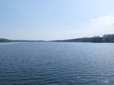 View from the footbridge over the Moehne Lake to the wide water of the dam, North Rhine-Westphalia, Germany