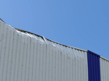 In May 2022, a tornado caused severe damage in Lippstadt, North Rhine-Westphalia, Germany, here the damaged roof of a factory building