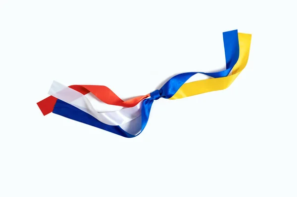 オランダとウクライナの2つの旗が白地に結び付けられた 戦争中のオランダからウクライナへの友情と寄付 ロイヤリティフリーのストック写真