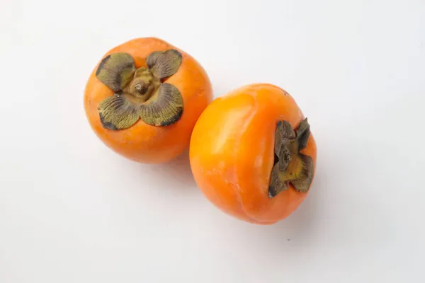 Twee Rijpe Persimmon Met Geïsoleerde Witte Achtergrond — Stockfoto