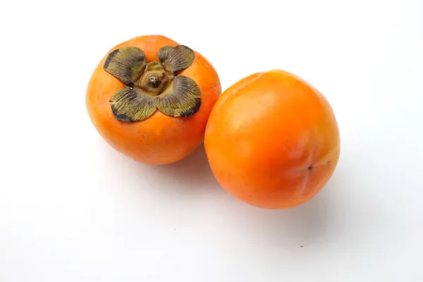 Twee Rijpe Persimmon Met Geïsoleerde Witte Achtergrond — Stockfoto