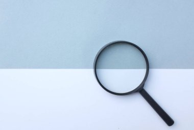 Magnifying glass on isolated gray and white background