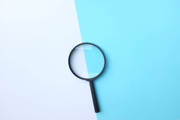 Magnifying glass on isolated blue and white background