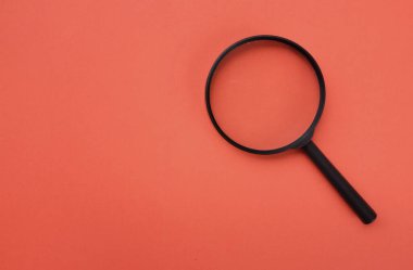 İnternet arama sembolü olarak loupe ya da büyüteç. kopyalama alanı olan turuncu arkaplan
