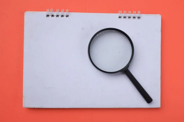 Top View Magnifying Glass Notebook Isolate Orange Background Searching Concept — 图库照片