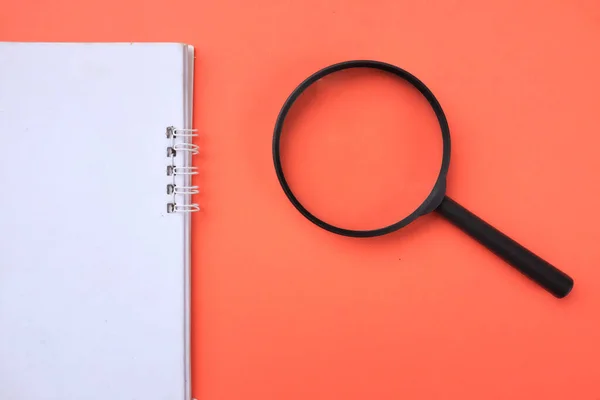 Top View Magnifying Glass Notebook Isolate Orange Background Searching Concept — Foto Stock