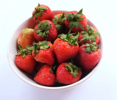 Fresh juicy strawberries  in a bowl isolate on a white  background