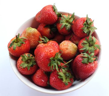 Fresh juicy strawberries  in a bowl isolate on a white  background