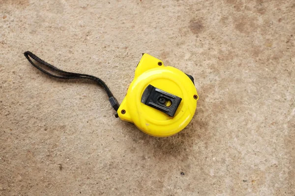 Flat Lay Top View One Yellow Tape Measure Cement Background — Stok fotoğraf