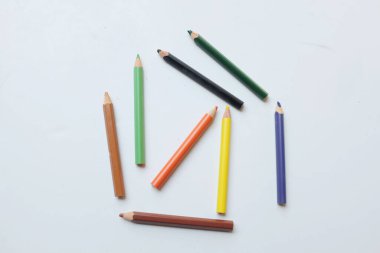 top view and flat lay a colored pencils isolate on white background. school stationery ,education, back to school concept