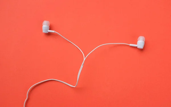 White Headphones Earphone Earbuds Headset Isolated Orange Bright Background — Stock Photo, Image