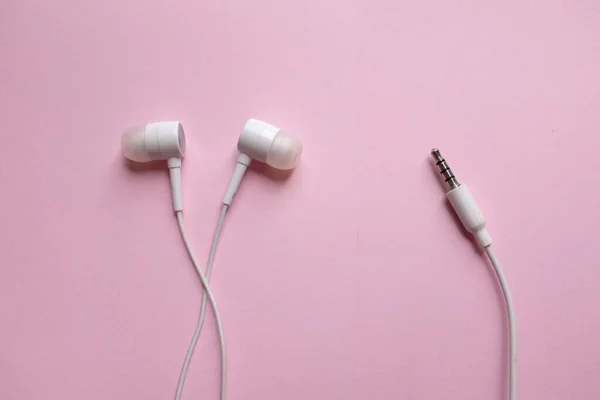 Από Ένα Πάνω Λευκό Ακουστικά Ακουστικά Ακουστικά Ακουστικά Απομονωμένο Ροζ — Φωτογραφία Αρχείου