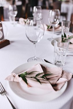 Beautiful table setting for wedding celebration in restaurant. Pink colours. Wedding decoration. 