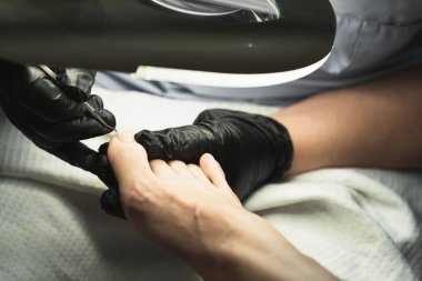 Tıbbi pedikür yakın plan, tamponad, ayak tırnağı.