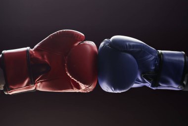 Two mens hands in boxing gloves. Confrontation concept