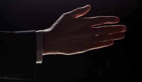 Man Holds Out His Hand Handshake Highlighted Black Background — Photo