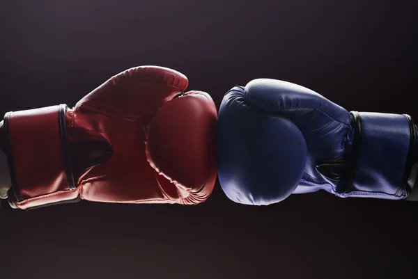 Two mens hands in boxing gloves. Confrontation concept