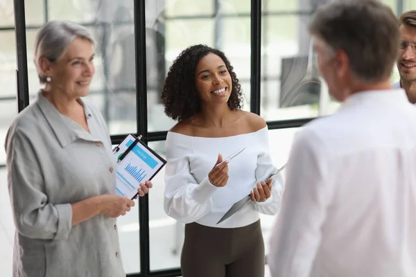 Conversation between managers and employees in the office