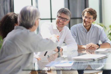 discussion of business people in the office sitting at the table