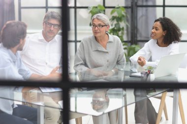 discussion of business people in the office sitting at the table