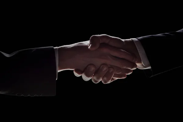 Photo Two Men Suits Shaking Hands Black Background — Zdjęcie stockowe