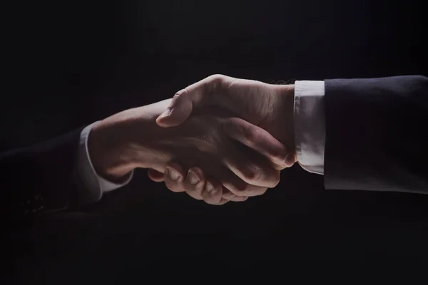 Photo Two Men Suits Shaking Hands Black Background — 图库照片