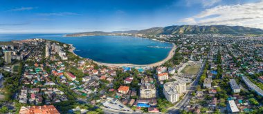 Panorama of Gelendzhik resort from a height, the Black Sea. The Gelendzhik Bay, the Caucasus Mountains are visible. Along the bay there are resort beaches, sanatoriums and boarding houses