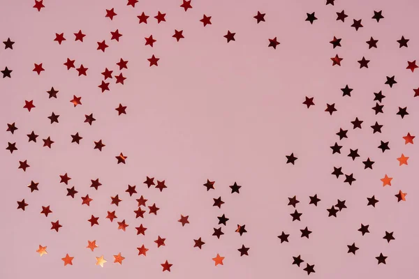 Soyut pembe arkaplan, yıldız şeklinde parıldıyor..