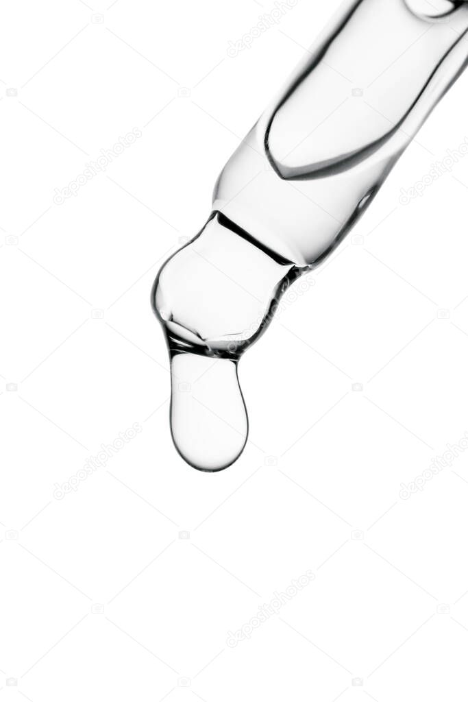 Transparent pipette with cosmetics on a white isolated background.