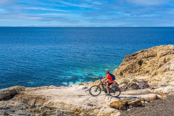 Nice Woman Riding Her Electric Mountain Bike Coastline Medanean Sea — стоковое фото