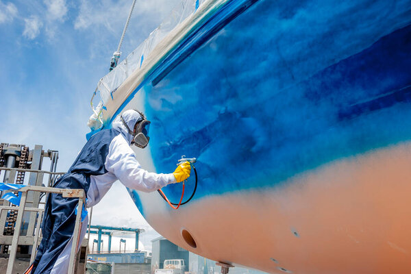 spray painter during the  painting of a ship's hull