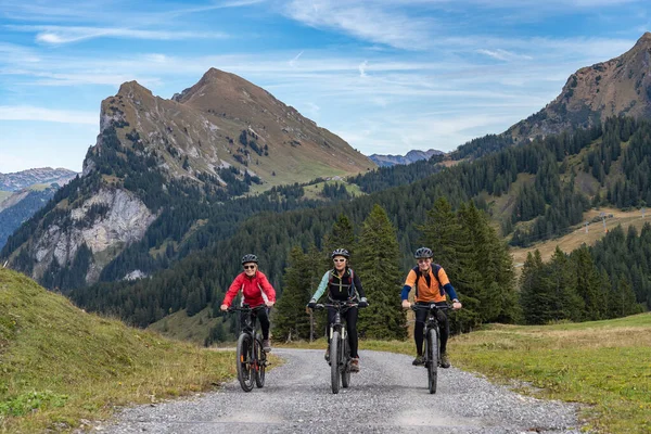 Three Happy Senior Adults Riding Mountain Bikes Autumnal Atmosphere Bregenz — Stock Photo, Image