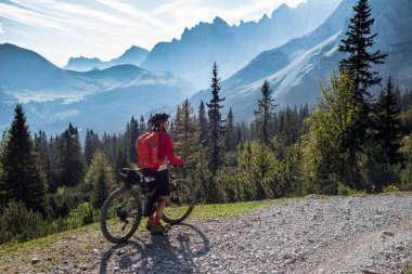 senior woman. riding her e-mountainbike in the karwendel mountain range, Tirol,Austria