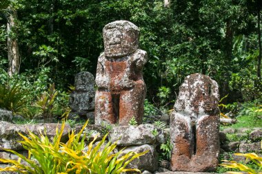 historic stone statues, so called Tikis, on Hiva Oa Island, Marquesas Islands, French Polynesia