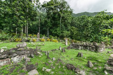 historic stone statues, so called Tikis, on Hiva Oa Island, Marquesas Islands, French Polynesia