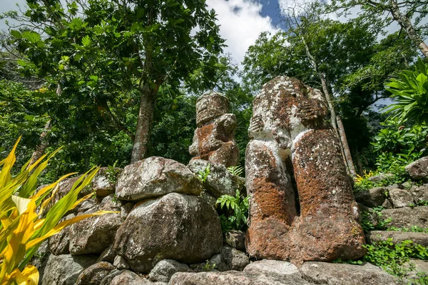 historic stone statues, so called Tikis, on Hiva Oa Island, Marquesas Islands, French Polynesia