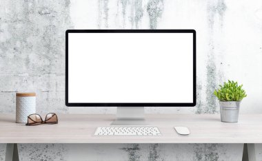 Ofis masasında bilgisayar görüntüsü. Model için izole ekran, sayfa sunumu. Çiçekli, gözlüklü ve kutulu bir masa. Arka planda beyaz kaba duvar