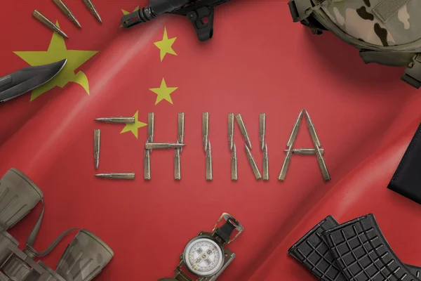 China military equipment on flag concept. Text writen with bullets. Top view, flat lay composition