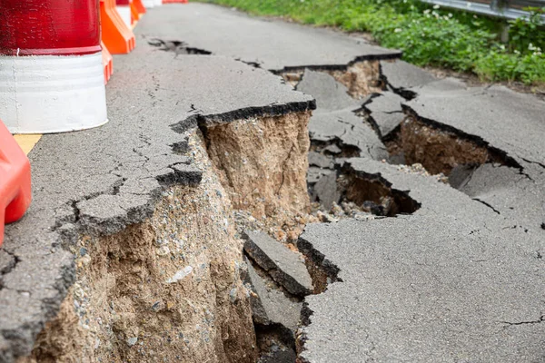 The paved road collapsed into cracks after the earthquake, non-standard construction.