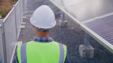 Engineer walk around solar cells station for checking system and maintenance solar panel