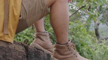 Close up on hike shoes. Hiker getting ready for hiking, sport and travel concept.