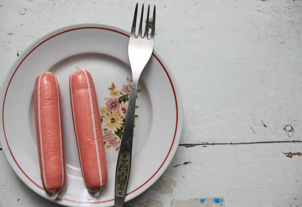 Two Sausages Plate Fork Old White Table — Stockfoto