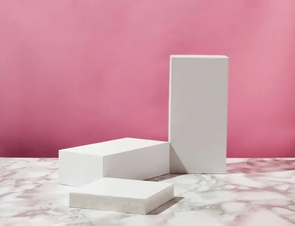 Product podium and pedestal. Suitable for Product Display and Business Concept. Pastel pink background and marble table. Modern aesthetic.