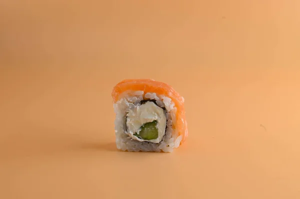 Close Piece Philadelphia Sushi Salmon Avocado Isolated Orange Background — 스톡 사진