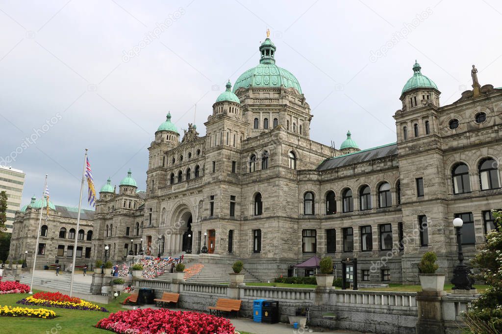 The main attraction of Vancouver and a favorite tourist destination is the British Columbia Parliament Building surrounded by flowerbeds with begonia in downtown Vancouver