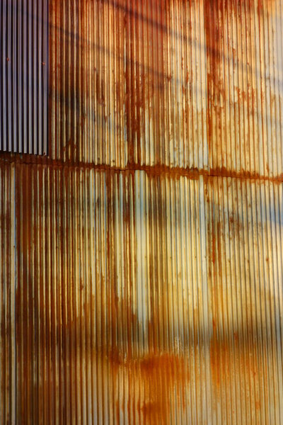 Abstract background pattern of old rusted galvanized iron plate