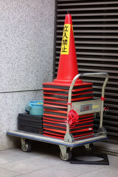 Lot Red White Color Cones Piled Wheelbarrow — 图库照片